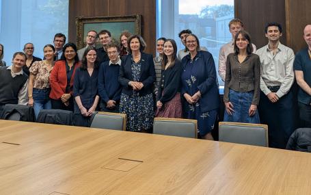 Students and faculty members meeting the Ambassador