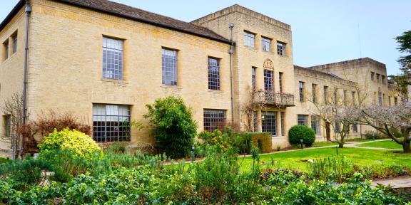 A picture of a building in St Anne's College surrounded by gardens. 