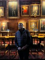 Gibson Ncube in a college dining hall at Oxford