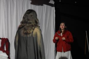 Theatre performance of two actors standing each other