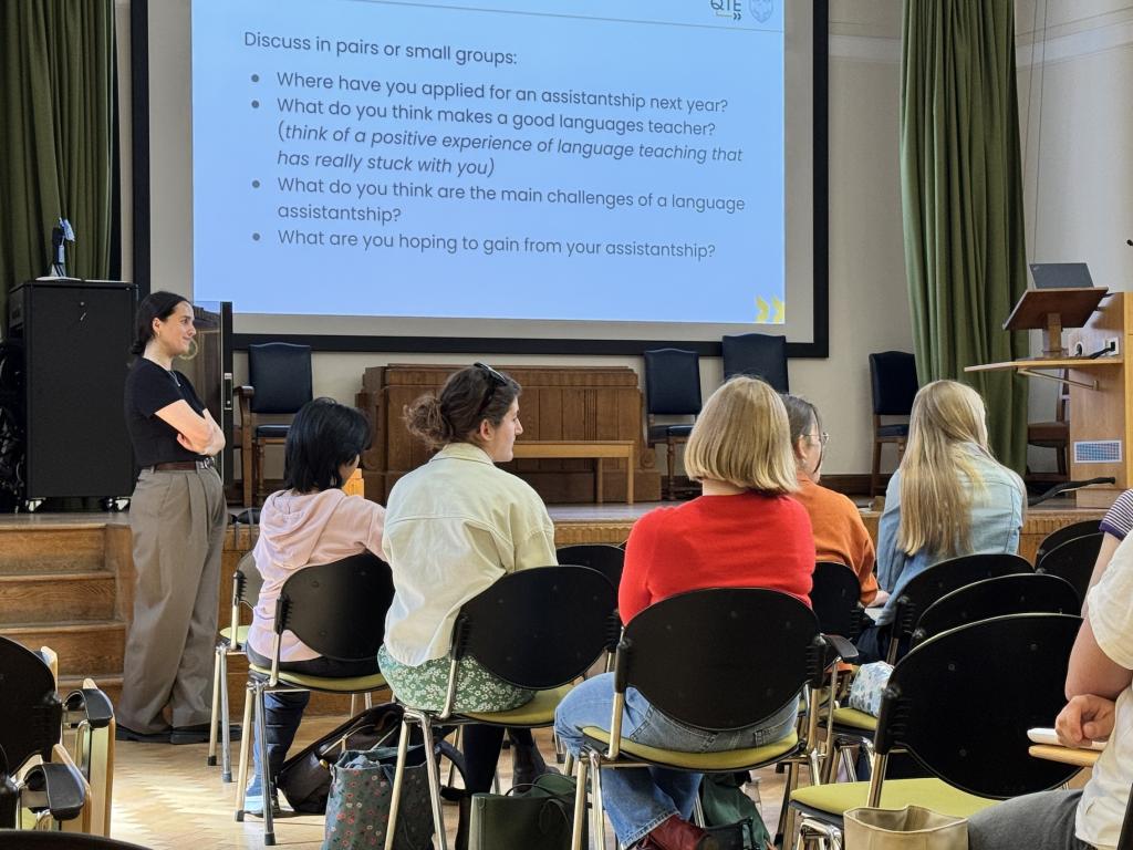 people in room with presentation on screen