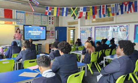 A classroom of school pupils watching a presentation entitled 'Why study languages?'