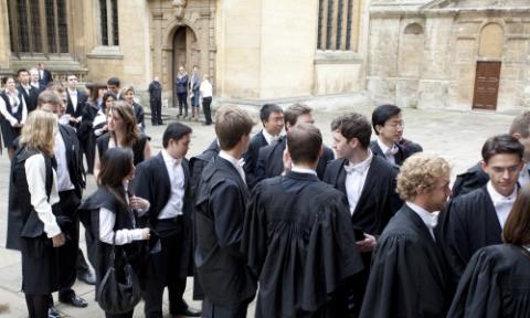 Photograph of a group of students in academic gowns