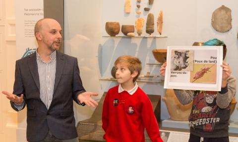 Dr Simon Kemp with school pupils