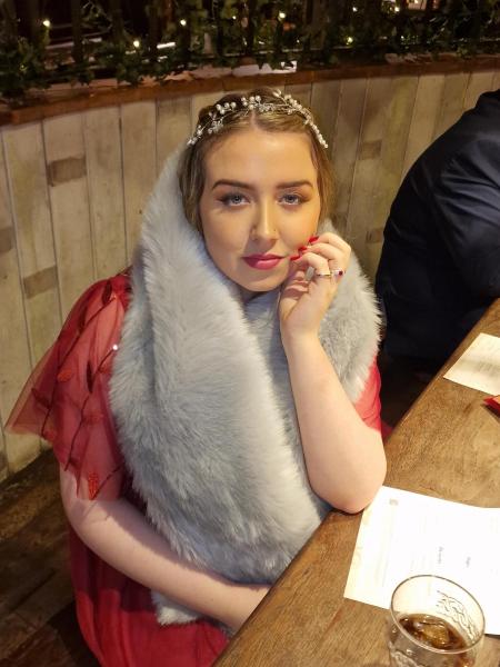 Photo of Madison Stanton-Kami seated at a table