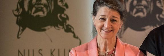 Photo of Marina Warner holding a Prize